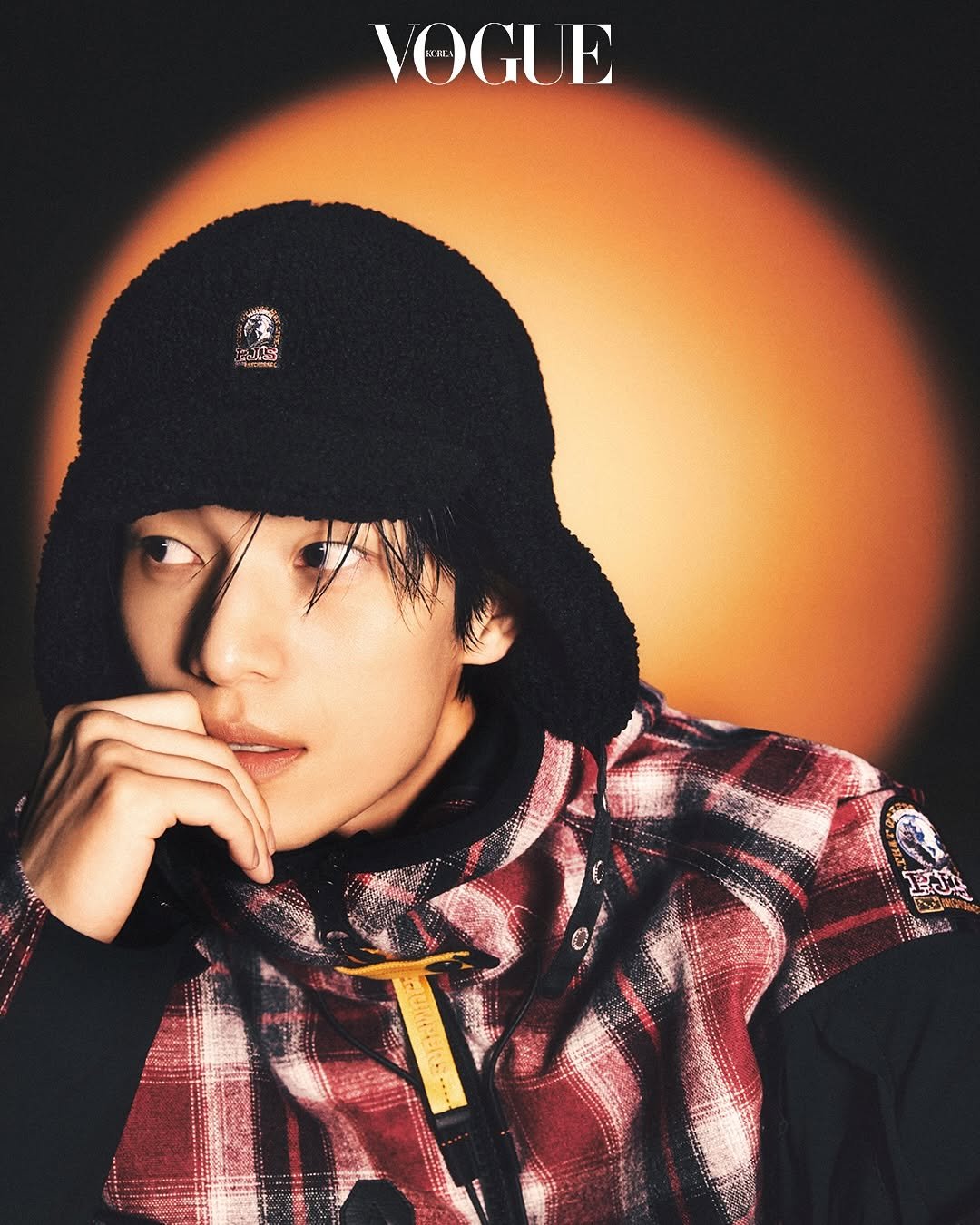 Photo shared by 위하준 Wi Ha Jun on October 23, 2025 tagging @voguekorea, and @parajumpers. May be an image of one or more people, bangs, poster, top, magazine and bolo tie.