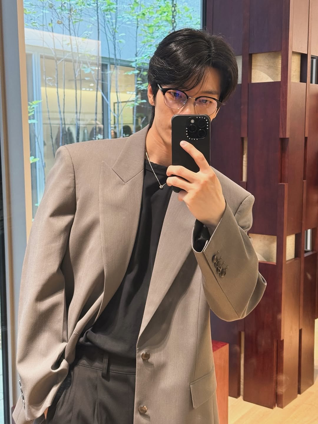 Photo shared by 위하준 Wi Ha Jun on September 12, 2025 tagging @recto_official, and @casetify_kr. May be an image of suit, blazer, dinner jacket and bolo tie.