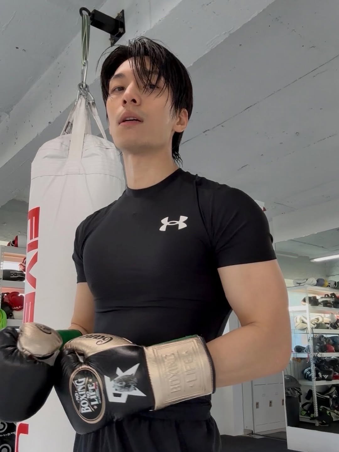 Photo by 위하준 Wi Ha Jun on November 03, 2025. May be an image of one or more people, biceps, punching bag and text.