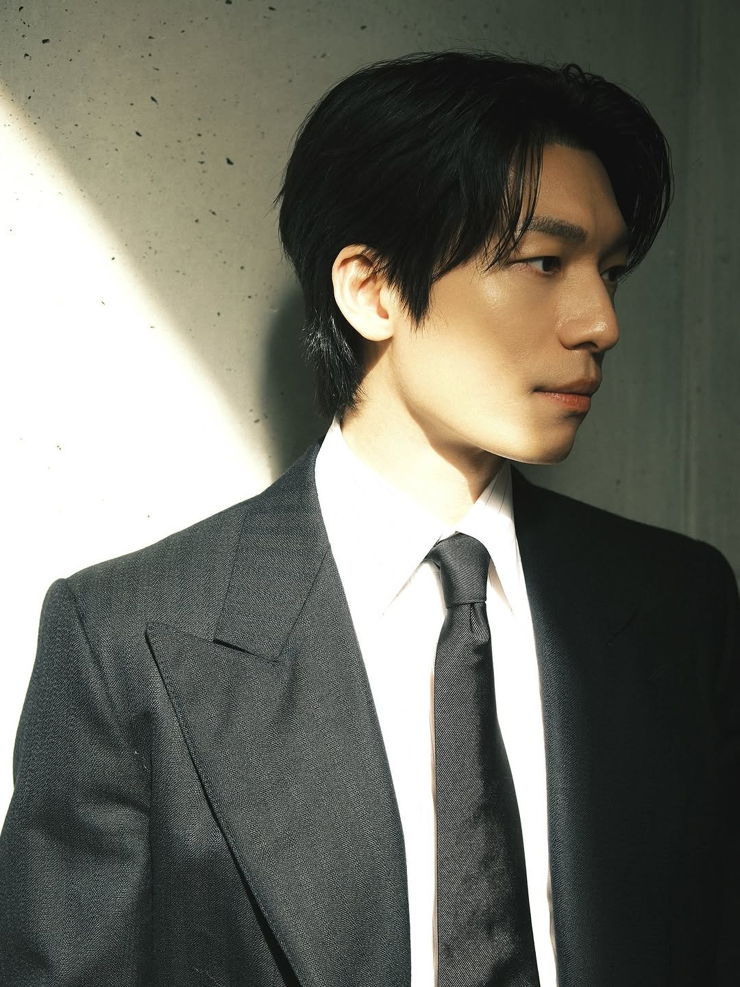 Photo shared by 위하준 Wi Ha Jun on February 02, 2026 tagging @yuvisionn. May be an image of one or more people, hair, duffle coat, bolo tie, blazer, suit and text.