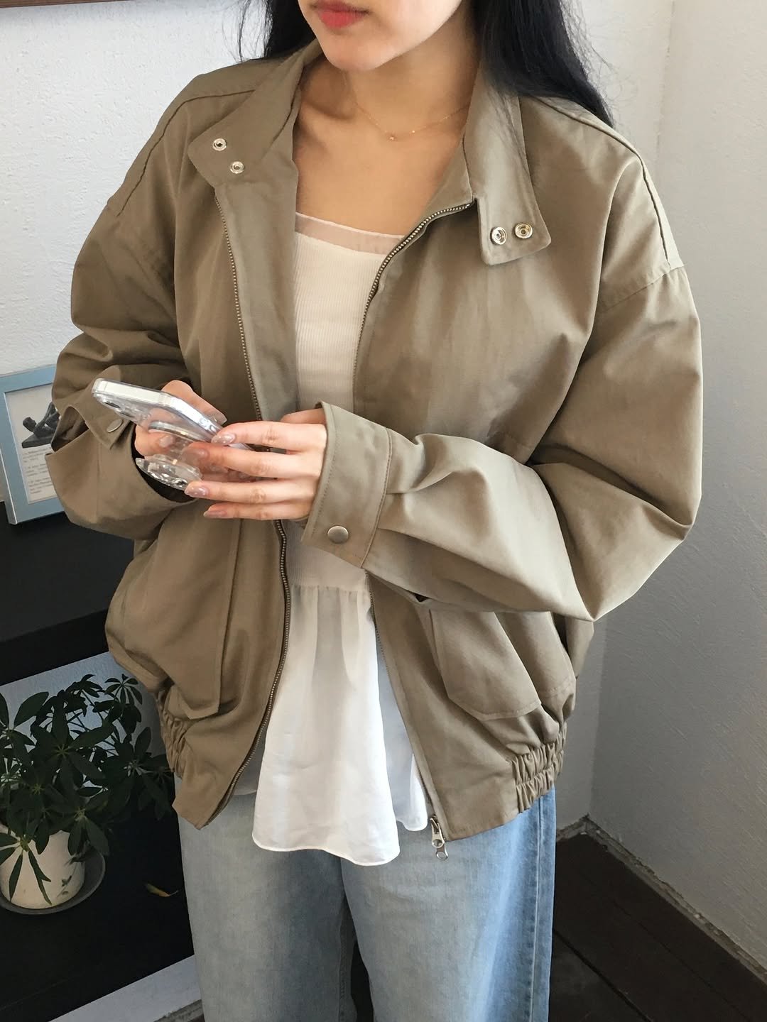 Photo by 윈미룸winmiroom on March 29, 2026. May be an image of parka, coat, flight jacket, top and text.