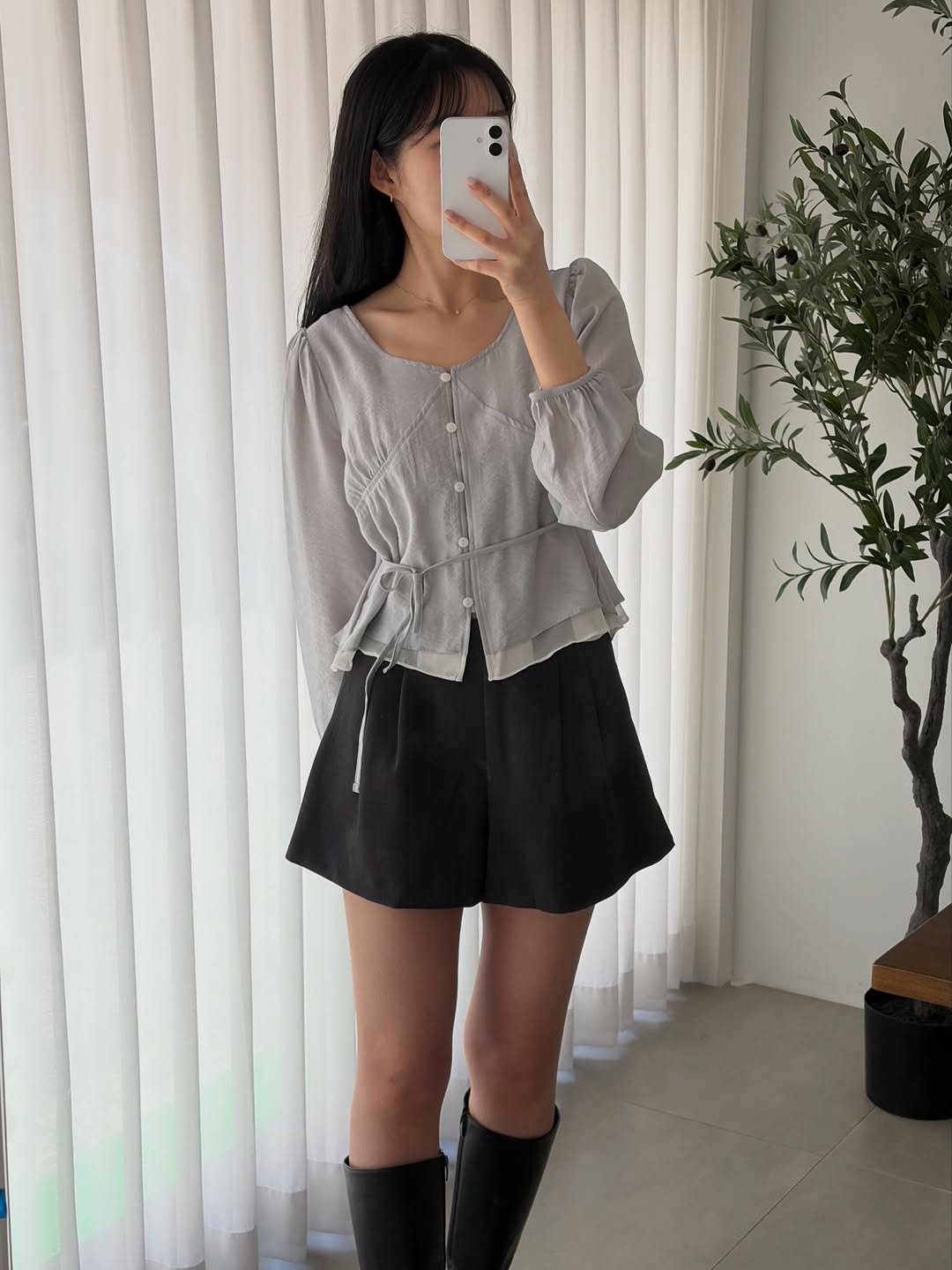 Photo by 윈미룸winmiroom on March 24, 2026. May be an image of skirt, top, miniskirt, boots, dress and text.