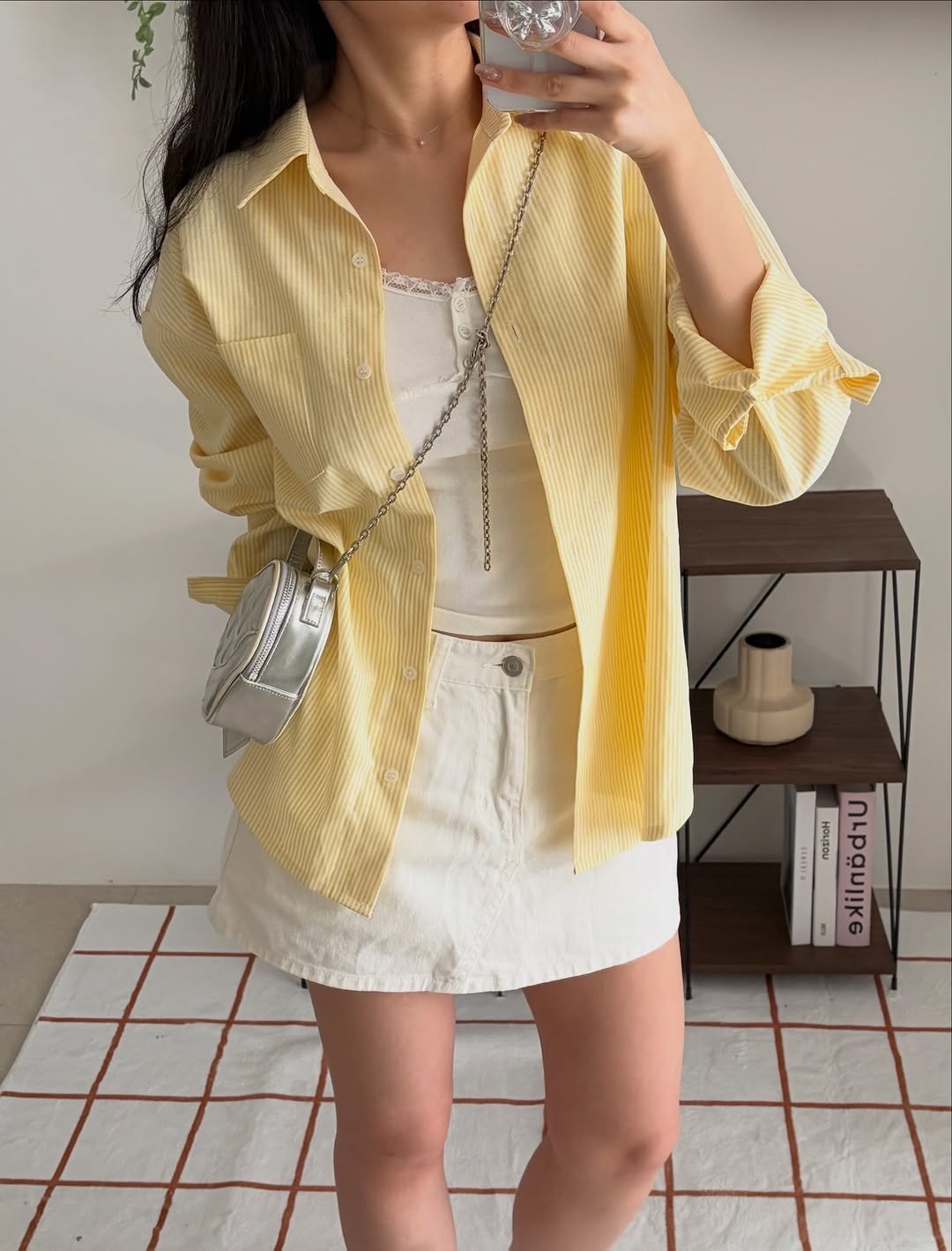 Photo by 윈미룸winmiroom on April 18, 2026. May be an image of skirt, outerwear, top, blazer, cardigan and text.