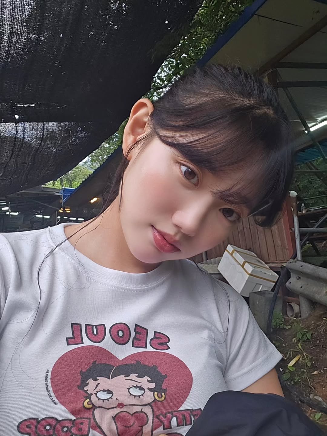 Photo shared by 조채윤 on August 15, 2025 tagging @bettyboop.kr. May be a selfie of 1 person, bangs, lipstick, top, outdoors and text.