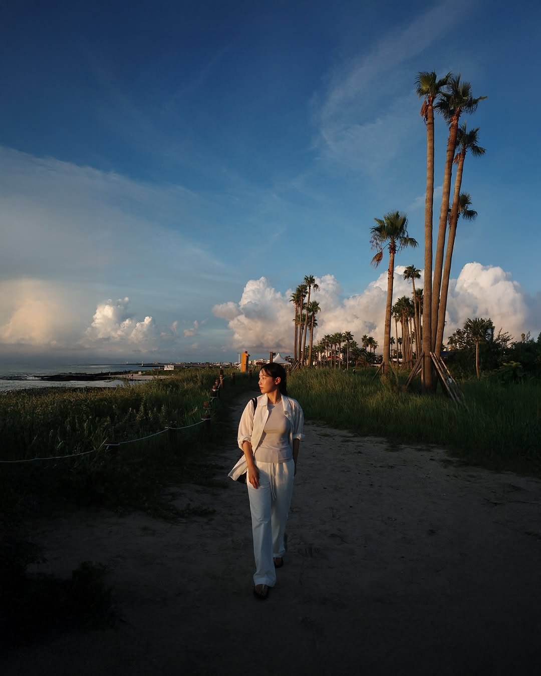 Photo by 위드주영 의정부메이크업 메이크업아티스트 on September 01, 2025. May be an image of 1 person, cloud, palm trees and text.