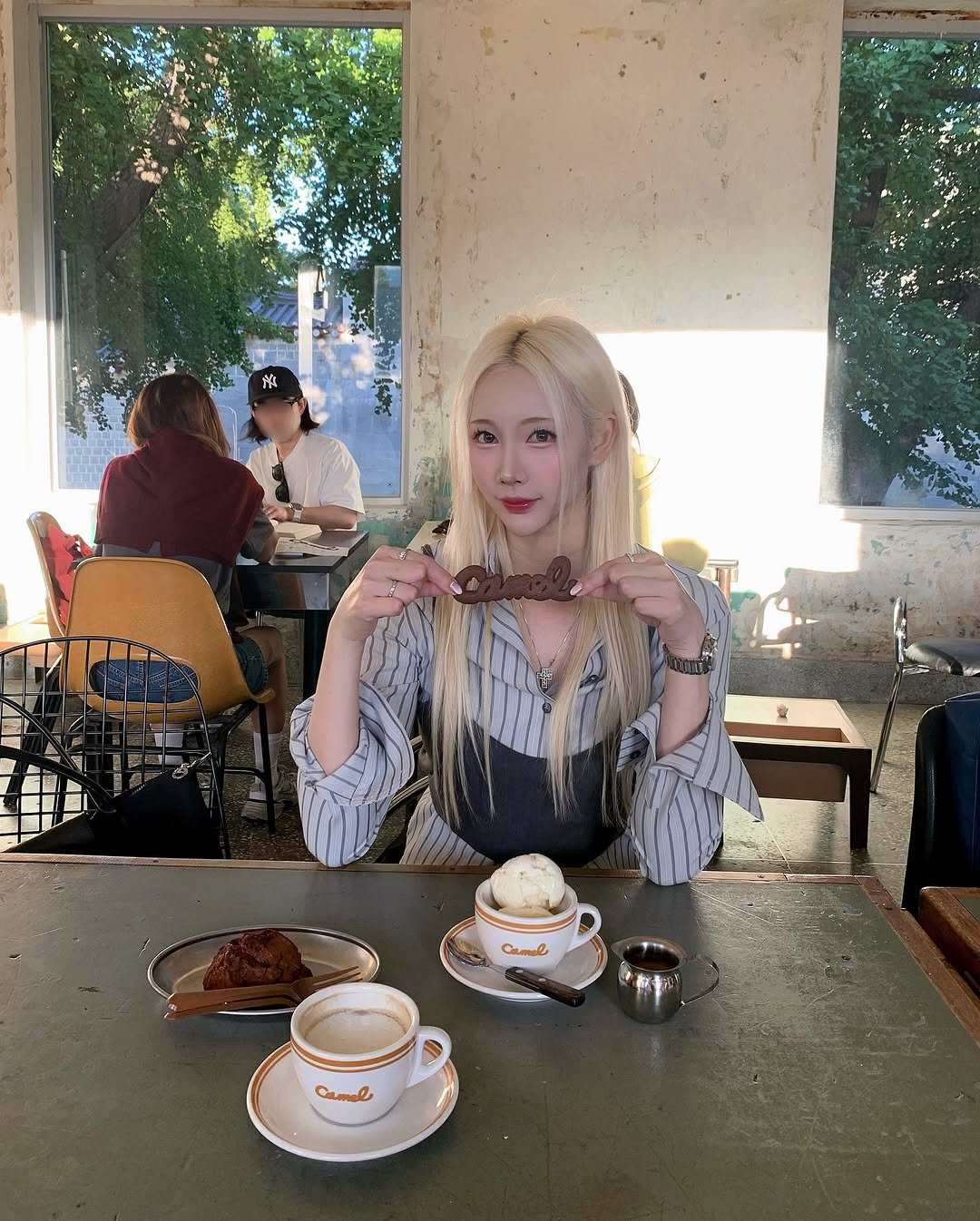 Photo shared by 예린 on October 10, 2025 tagging @jcho_official. May be an image of one or more people, blonde hair, teacup, tea and text.
