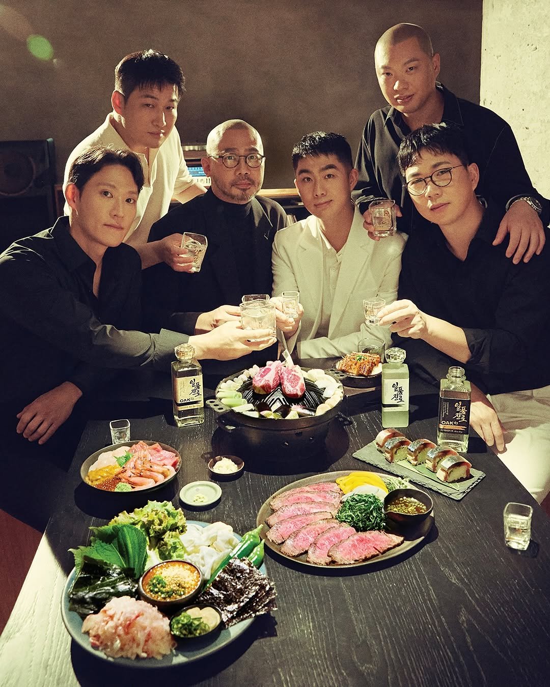 Photo by W Korea on October 03, 2025. May be an image of 5 people, hot pot, steak, sushi, chopsticks and text.