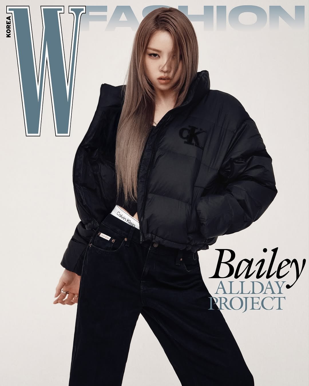 Photo shared by W Korea on November 13, 2025 tagging @baileysok, and @allday_project. May be an image of one or more people, makeup, jacket, turtleneck, magazine, coat, parka and text that says 'HION T ana Calvin CalvinKlein Klein 招雅 Bailey ALLDAY PROJECT'.