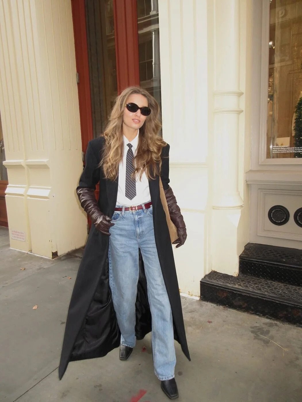 Photo shared by W Korea on December 29, 2025 tagging @olviyaaaaa. May be an image of overcoat, suit, eyewear, blazer and text.