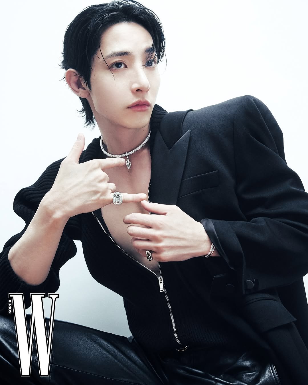 Photo shared by W Korea on November 13, 2025 tagging @leesoohyuk, and @messika. May be an image of bolo tie and text.