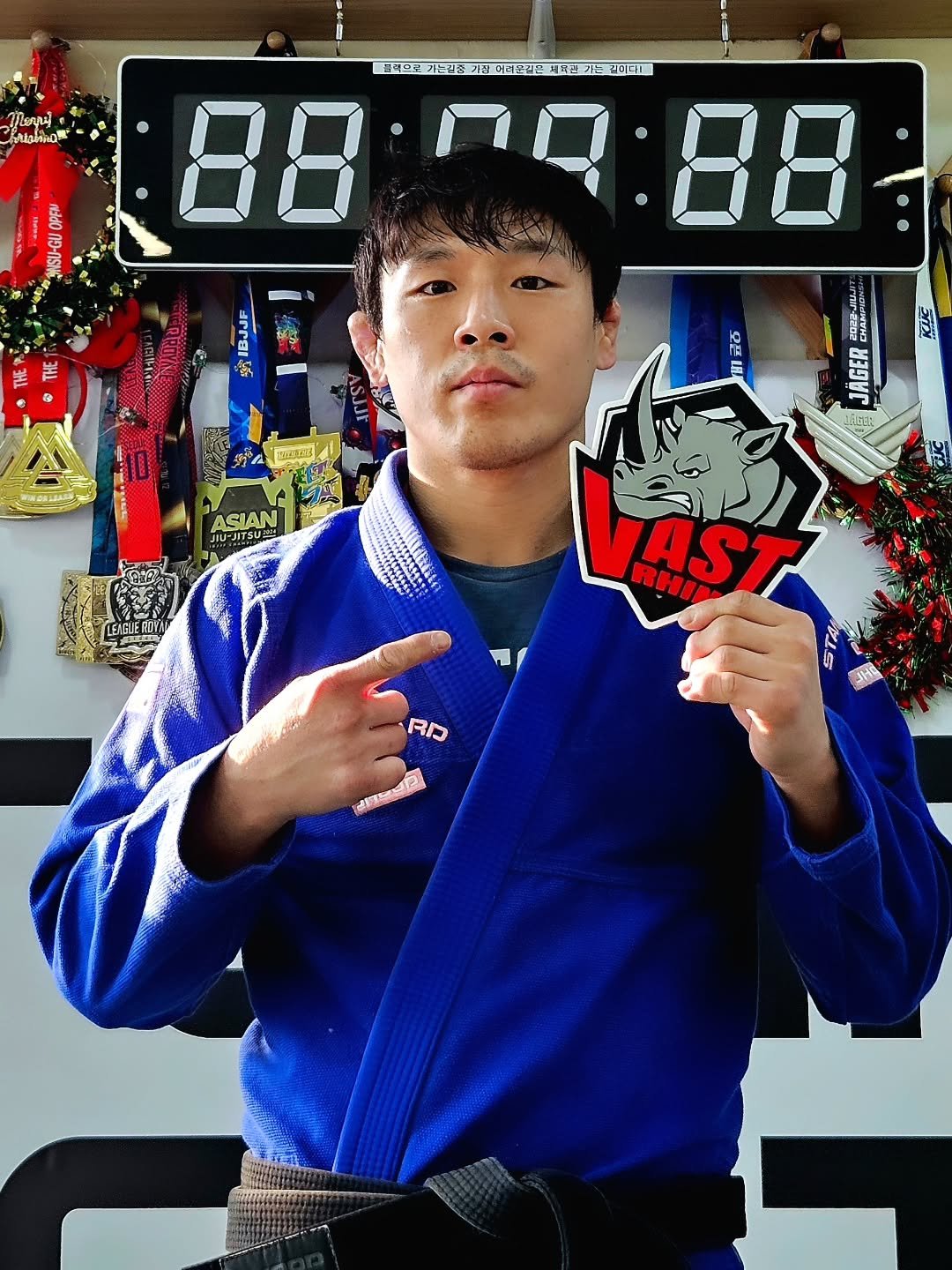 Photo shared by VAST_RHINO on February 20, 2026 tagging @won.hee_bjj. May be an image of martial arts, belt, timer and text.