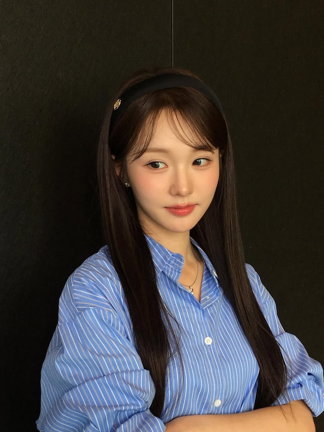 Photo by WOOAH 우아 on October 31, 2025. May be an image of one or more people, hair, top and text.