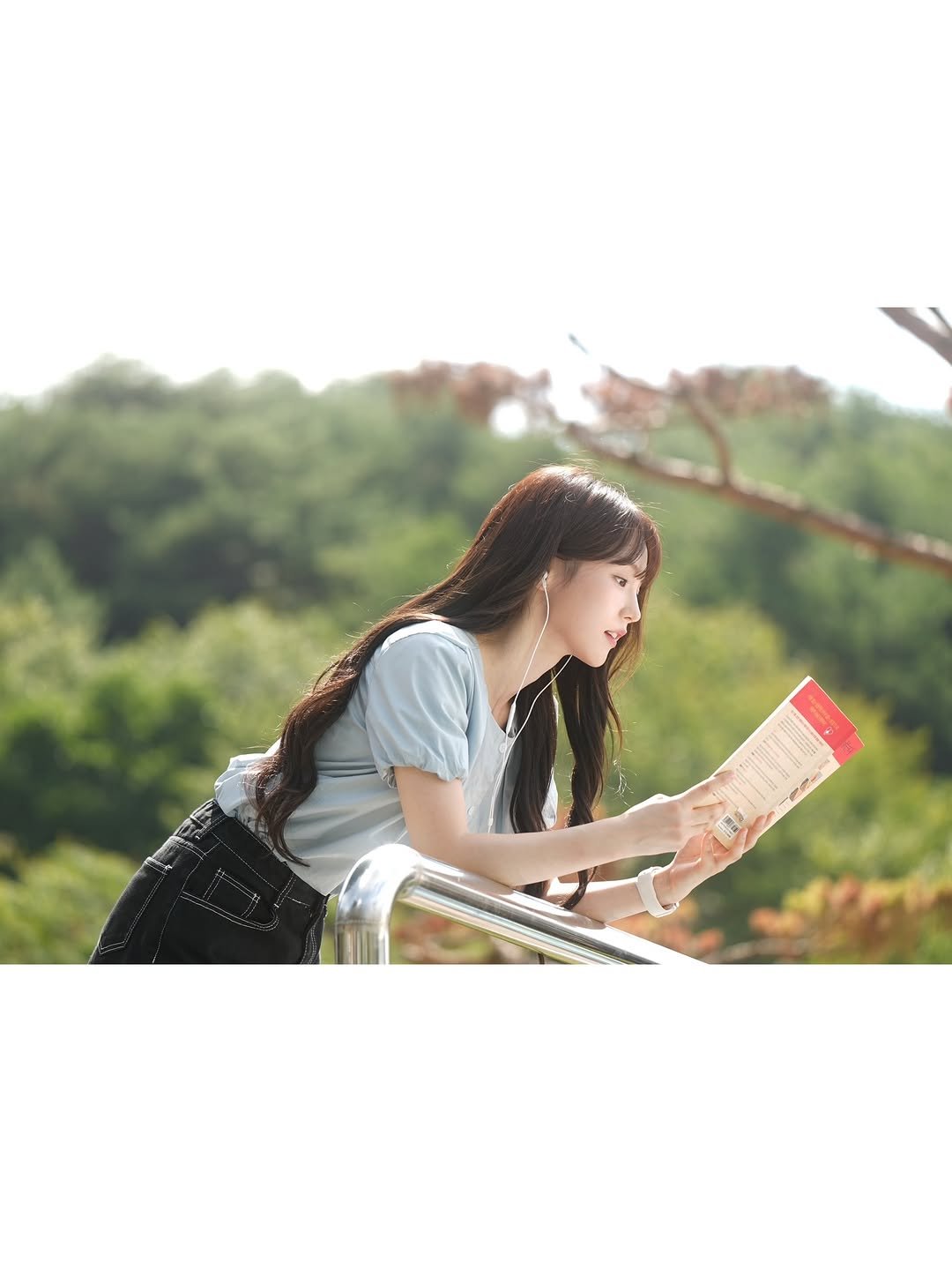 Photo by WOOAH 우아 on December 27, 2025. May be an image of one or more people, braids, book, outdoors and text.