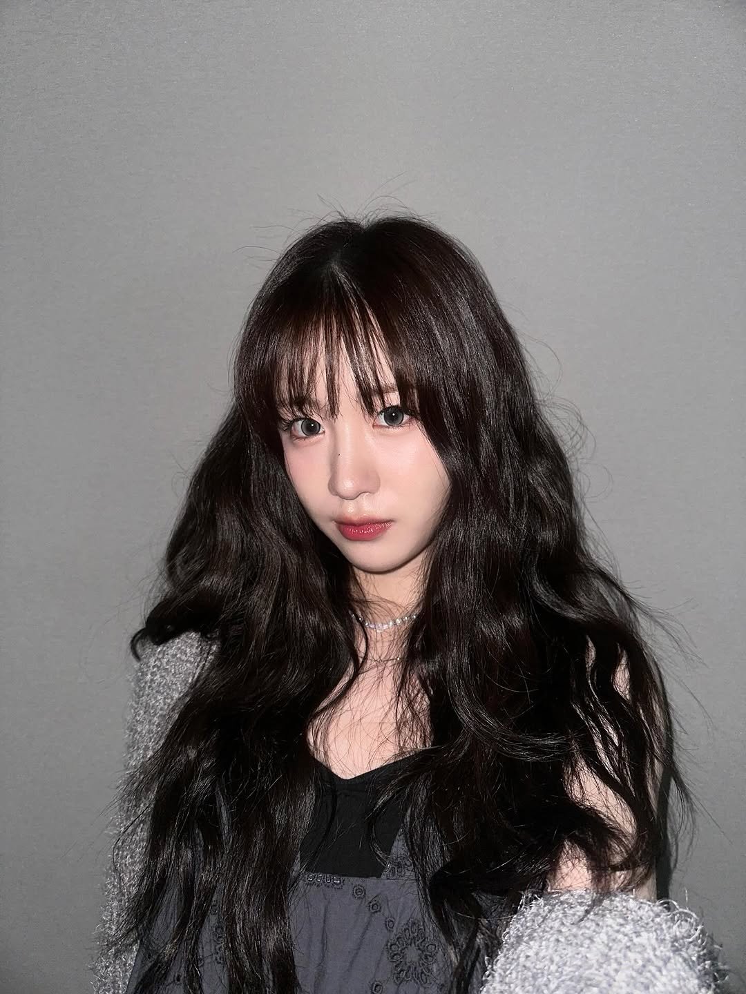 Photo by WOOAH 우아 on September 06, 2025. May be an image of 1 person, bangs, top and text.