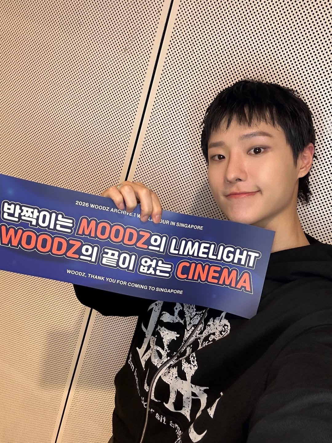 Photo shared by WOODZ OFFICIAL on April 02, 2026 tagging @woodz_dnwm. May be an image of text that says '반짝이는 2026 WOODZ ARCHIVE.1V WOODZI 끝이 MOODZOI JUR IN SINGAPORE L1 WOODZ, ΗΑΝK 끝이없는 없는 LIMELIGHT YOU FOR COMING To SINGAPORE CINEMA 上地 無蜜道 sit'.
