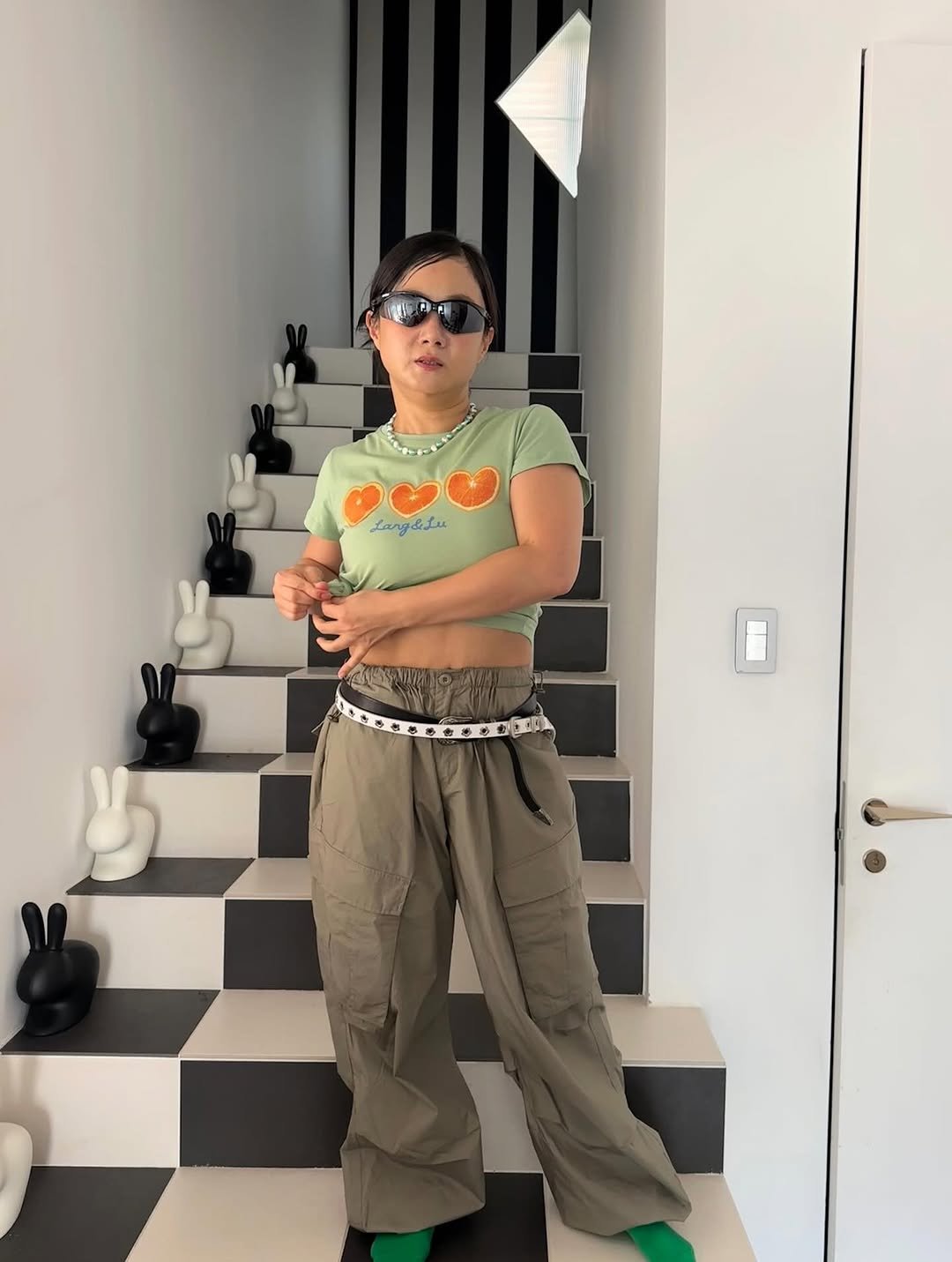 Photo by 나래 박 on July 20, 2025. May be an image of 1 person, glasses, sweatpants, checker board and text.