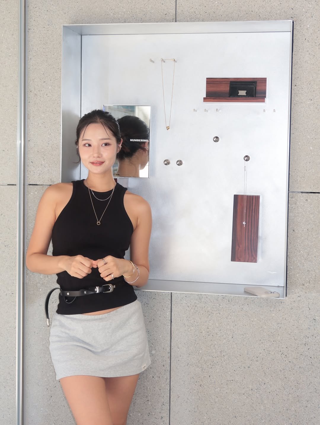 Photo shared by 우나스 woonas on September 11, 2025 tagging @numbering_official. May be an image of parking meter, portable cassette player, miniskirt and text.