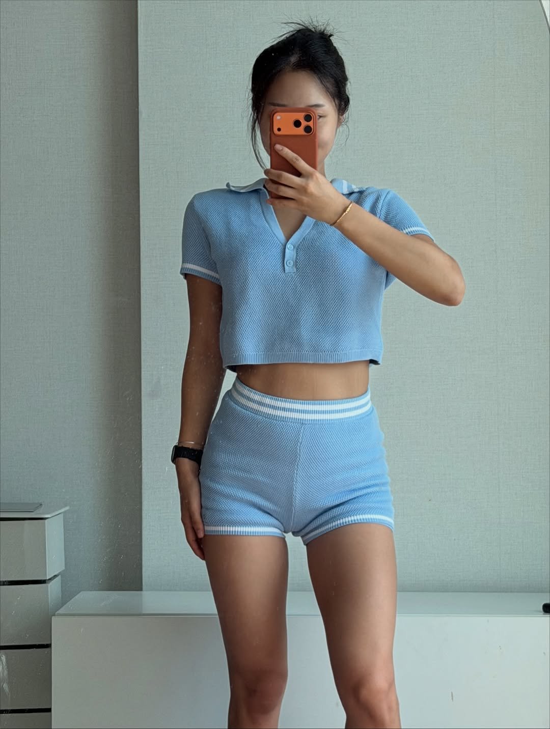 Photo by 우나스 woonas on September 23, 2025. May be an image of sleepwear, skirt, shorts, miniskirt and text.