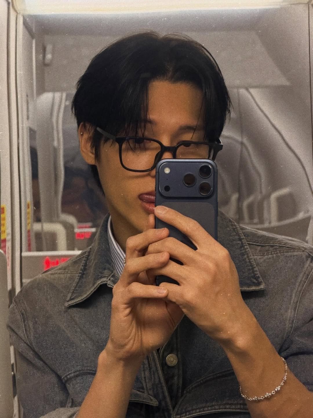 Photo shared by woodeoki on March 14, 2026 tagging @wooyounggg__. May be an image of one or more people, hair, phone, mirror and text.