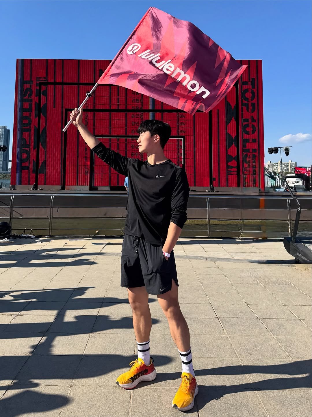 Photo shared by 민규 on November 02, 2025 tagging @lululemon, and @lululemonkr. May be an image of standing, sweat band, sportswear, bandanna, stadium and text.