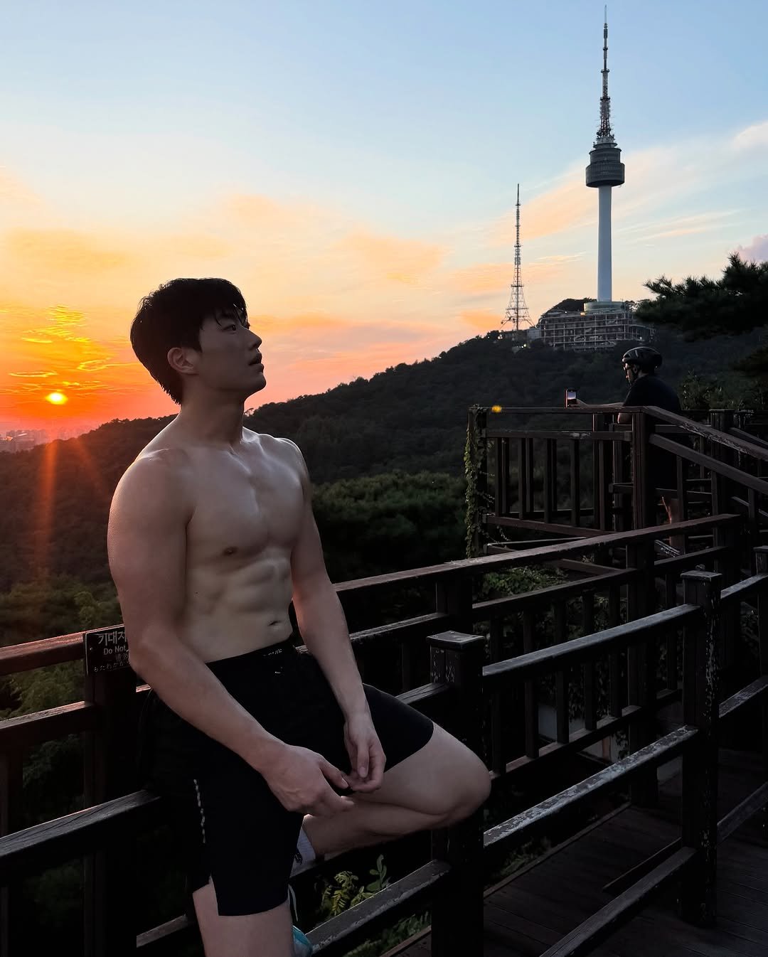Photo shared by 민규 on August 07, 2025 tagging @f45_training_hannam. May be an image of 2 people, biceps, the CN Tower, twilight, outdoors and text.