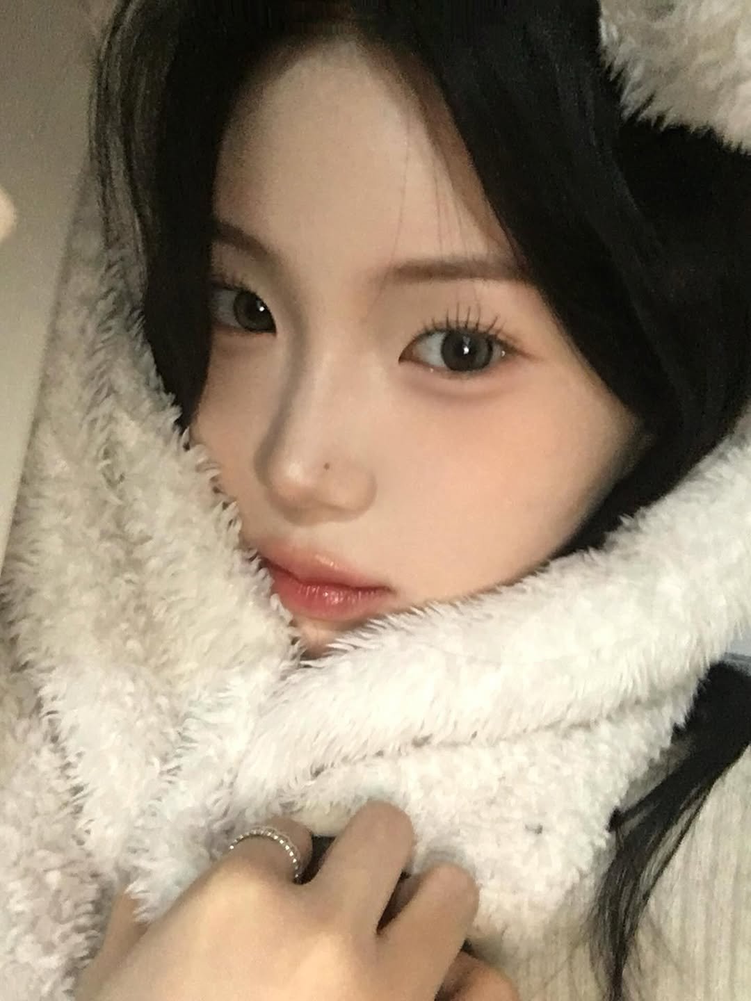 Photo by 강다인 on December 06, 2025. May be an image of one or more people, hair, parka, bath robe and text.