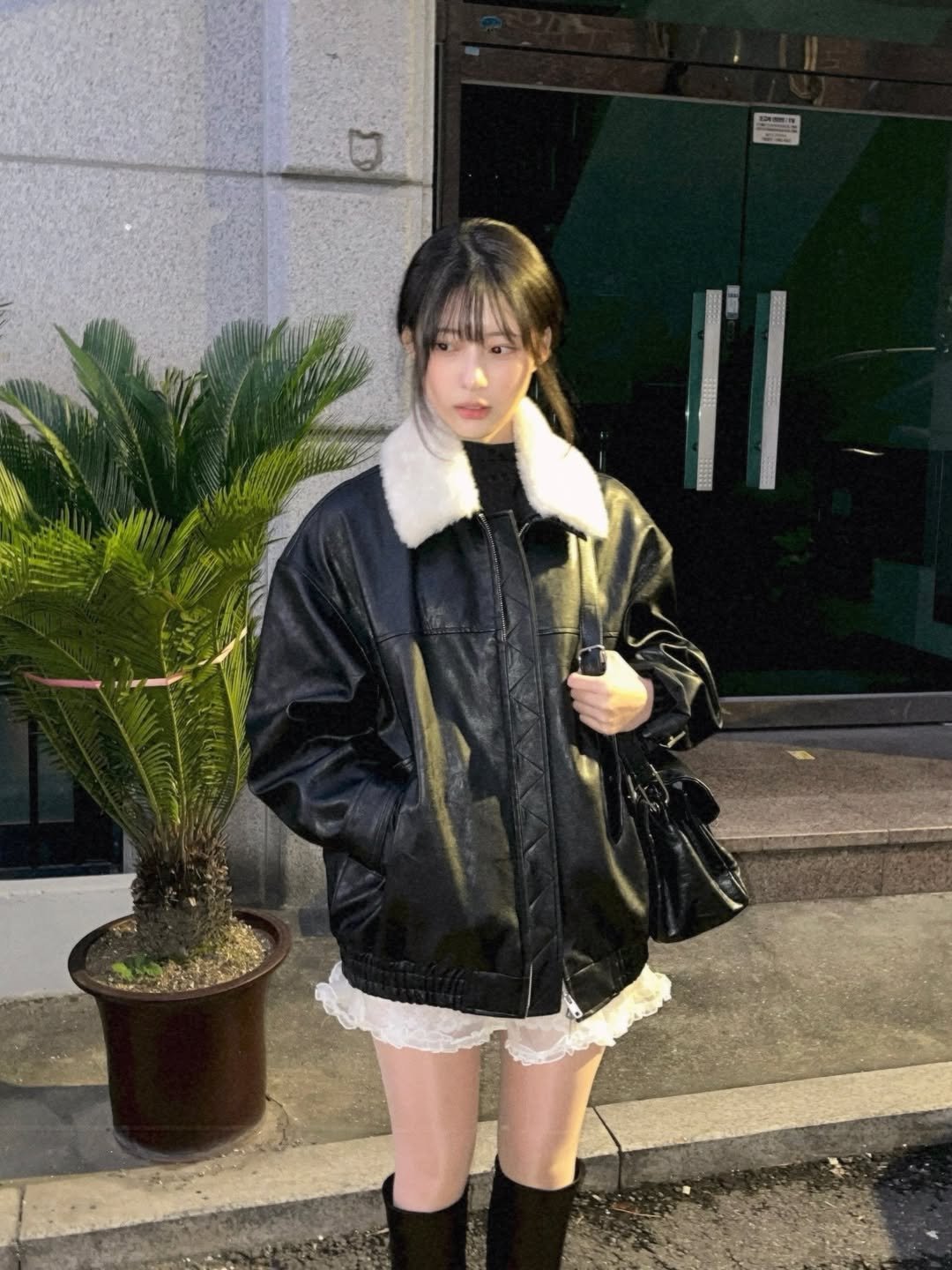 Photo shared by 이자민 on October 26, 2025 tagging @afterhours.co.kr. May be an image of duffle coat, overcoat, jacket, parka, miniskirt and text.