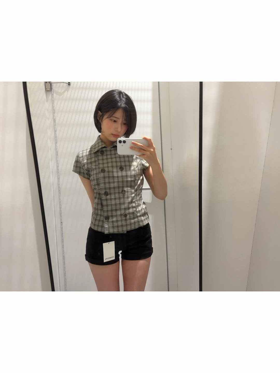 Photo shared by 이자민 on February 18, 2026 tagging @synerjyn_official. May be an image of sleepwear, mirror, clothes hanger, shorts, top and text.