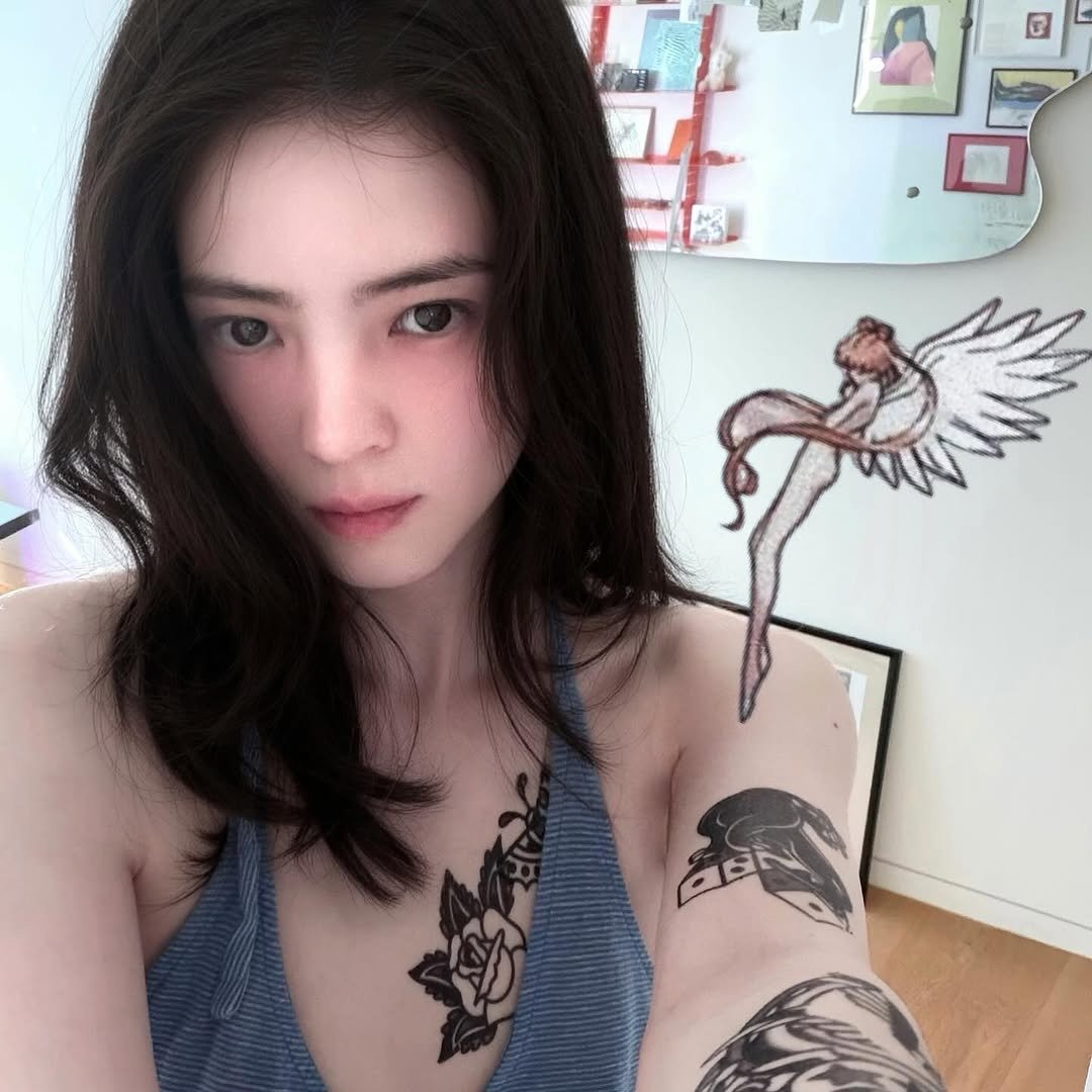 Photo by 한소희 on November 21, 2025. May be an illustration of one or more people, tattoo, hair and text.