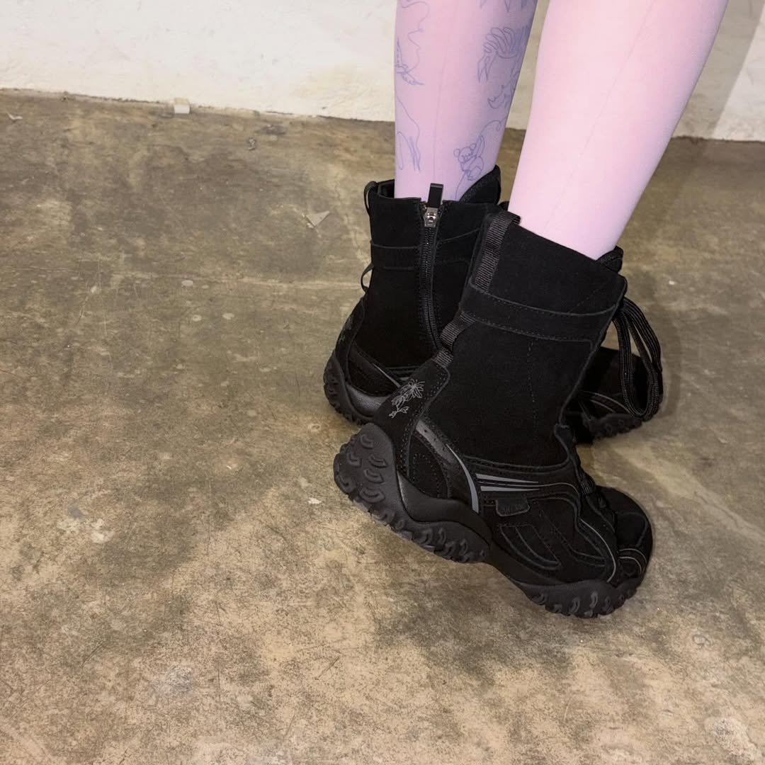 Photo by 한소희 on December 08, 2025. May be an image of boots and tights.