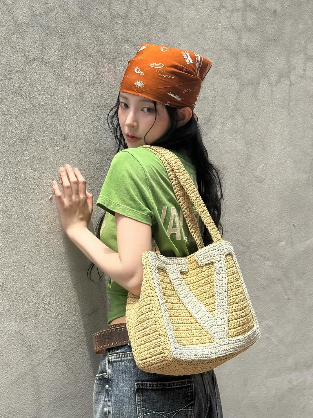 Photo shared by 신수현 on July 06, 2025 tagging @maisonvalentino. May be an image of bandanna, grocery bag, crochet, headscarf and sling.