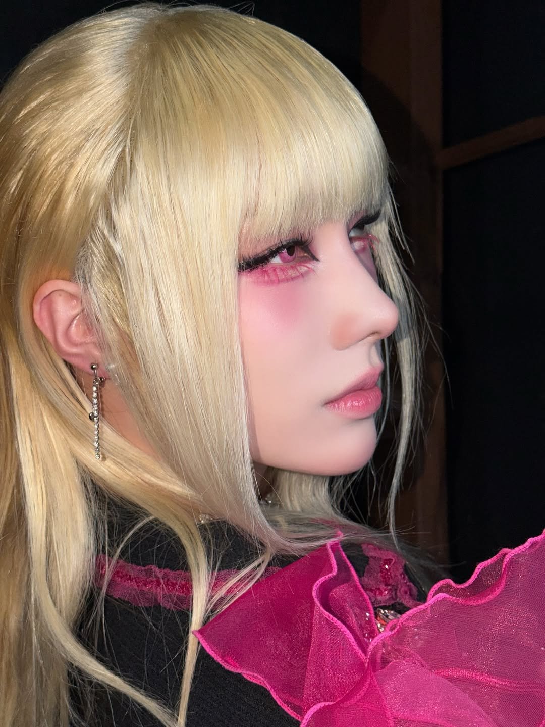 Photo by XLOV on March 02, 2026. May be an image of one or more people, blonde hair, makeup, costume and text.