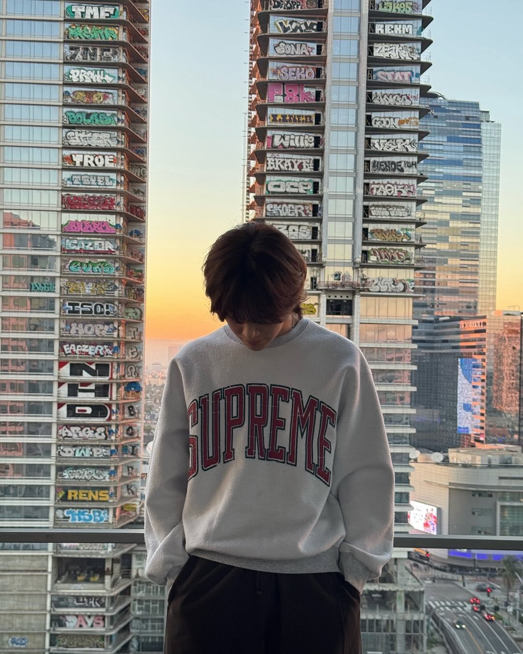 Photo by TAEMIN on March 26, 2026. May be an image of sweatpants, skyscraper and text.