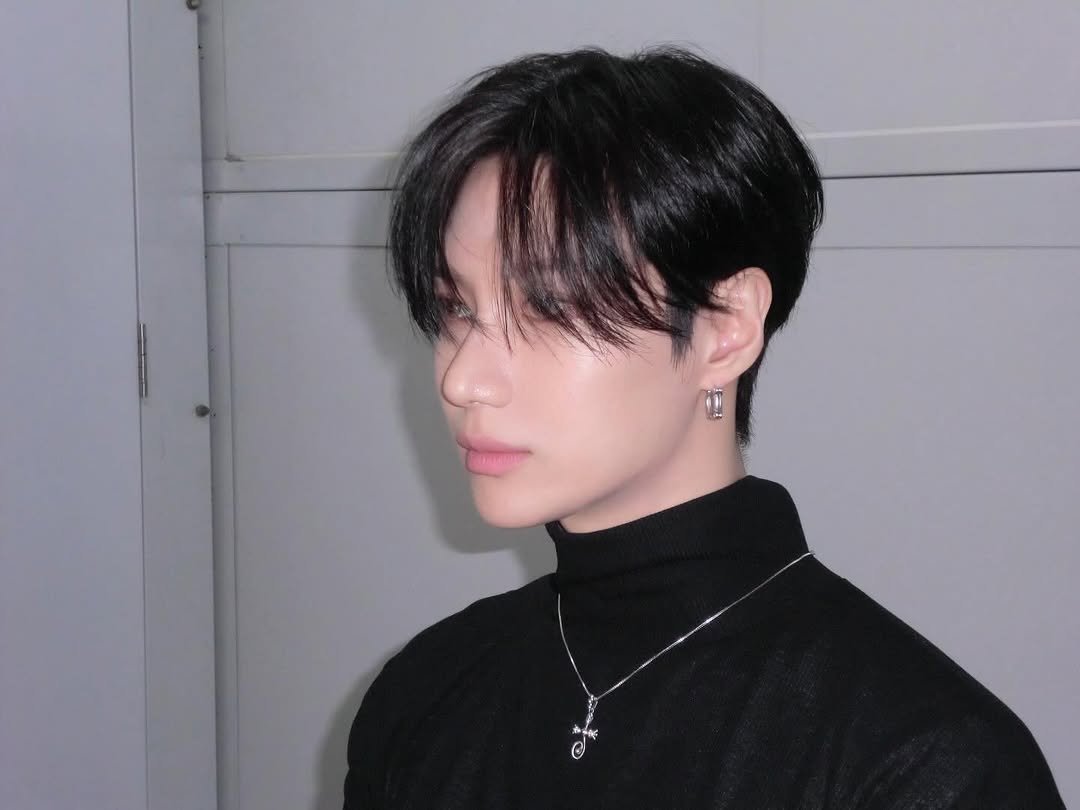 Photo by TAEMIN on March 14, 2026. May be an image of one or more people, bangs, top, turtleneck, bolo tie and text.