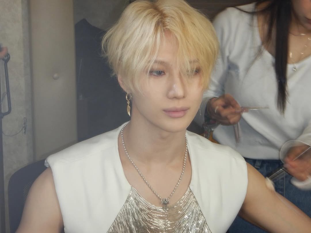 Photo by TAEMIN on April 20, 2026. May be an image of one or more people, bangs, bolo tie and text.