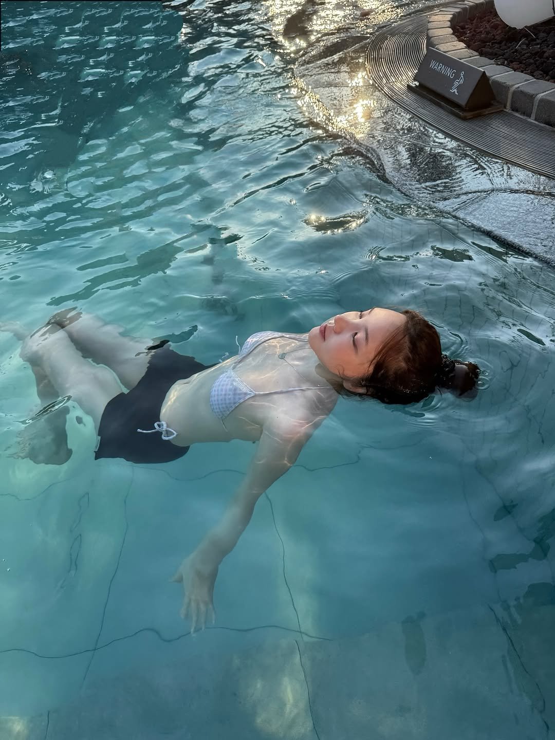 Photo by xöoos 수스 on August 01, 2025. May be an image of 1 person, swimming, glasses, wetsuit, pool and text.