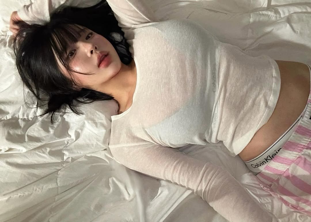 Photo by 유유 on December 19, 2025. May be an image of sleepwear, bed, underwear, miniskirt, bedroom and text.