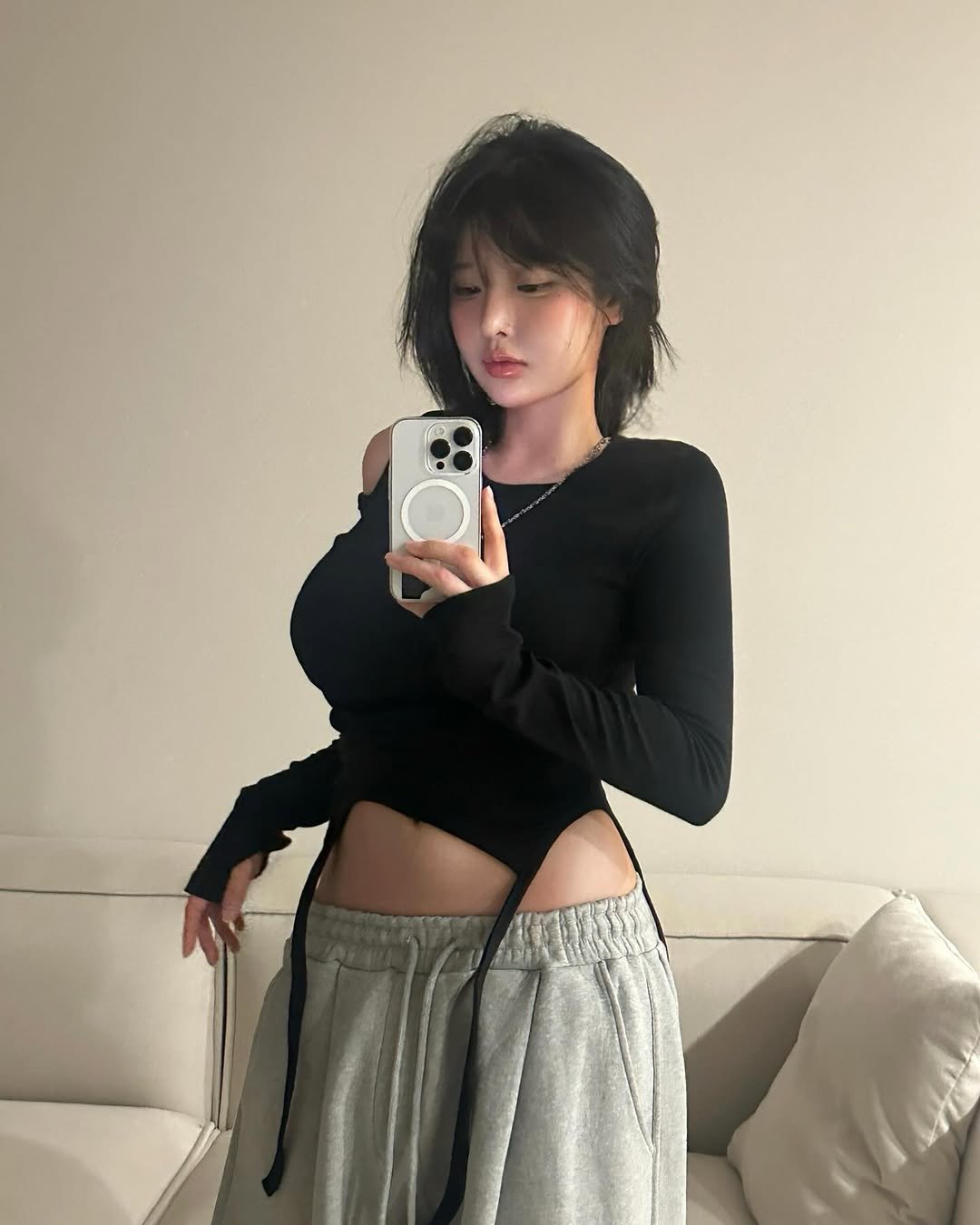 Photo by 유유 on November 22, 2025. May be a selfie of one or more people, hair, top, sweatpants and miniskirt.