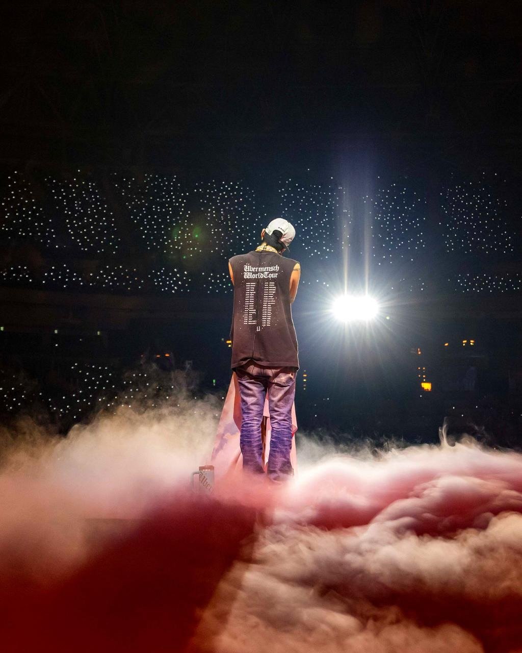 Photo by G-DRAGON on December 22, 2025. May be an image of microphone, concert and text.