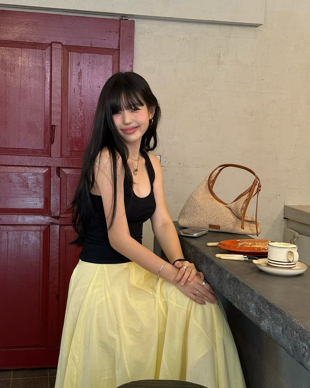 Photo shared by 해삐 on August 13, 2025 tagging @couronne_official. May be an image of 1 person, skirt, sundress and text.