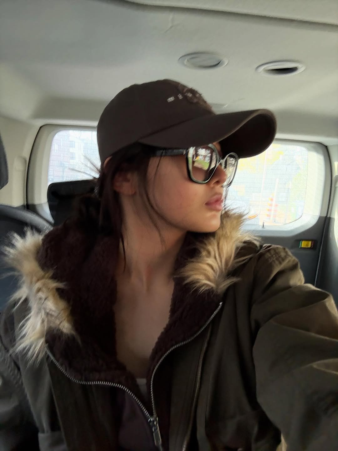 Photo by YOONCHAE JEUNG on November 22, 2025. May be a selfie of hat, goosedown coat, fur coat, parka, flight jacket and text.
