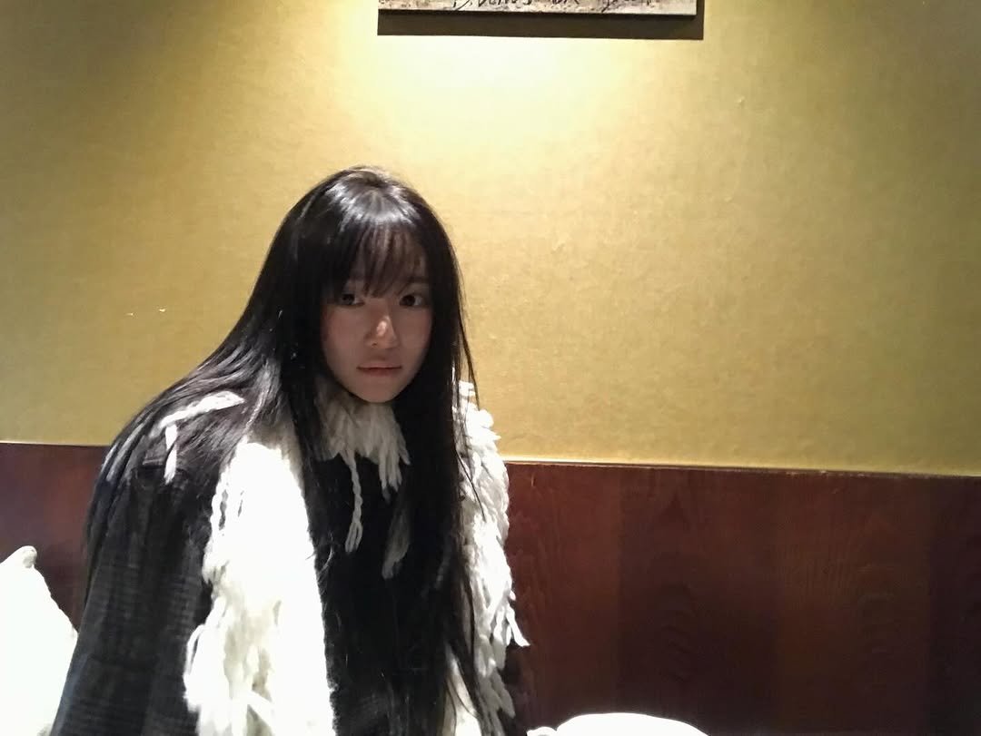 Photo by 연주 on December 24, 2025. May be an image of one or more people, hair, parka and text.