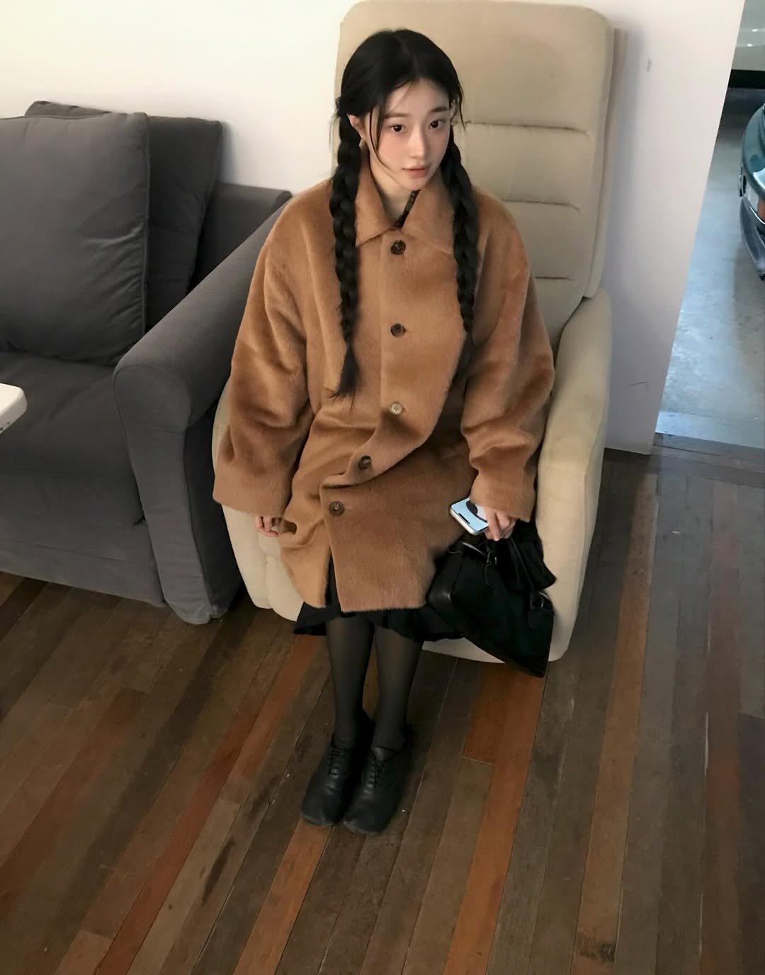 Photo shared by 연주 on December 19, 2025 tagging @kalmte_official. May be an image of one or more people, braids, duffle coat, overcoat, fur coat, goosedown coat, cloak, parka, beret and text.