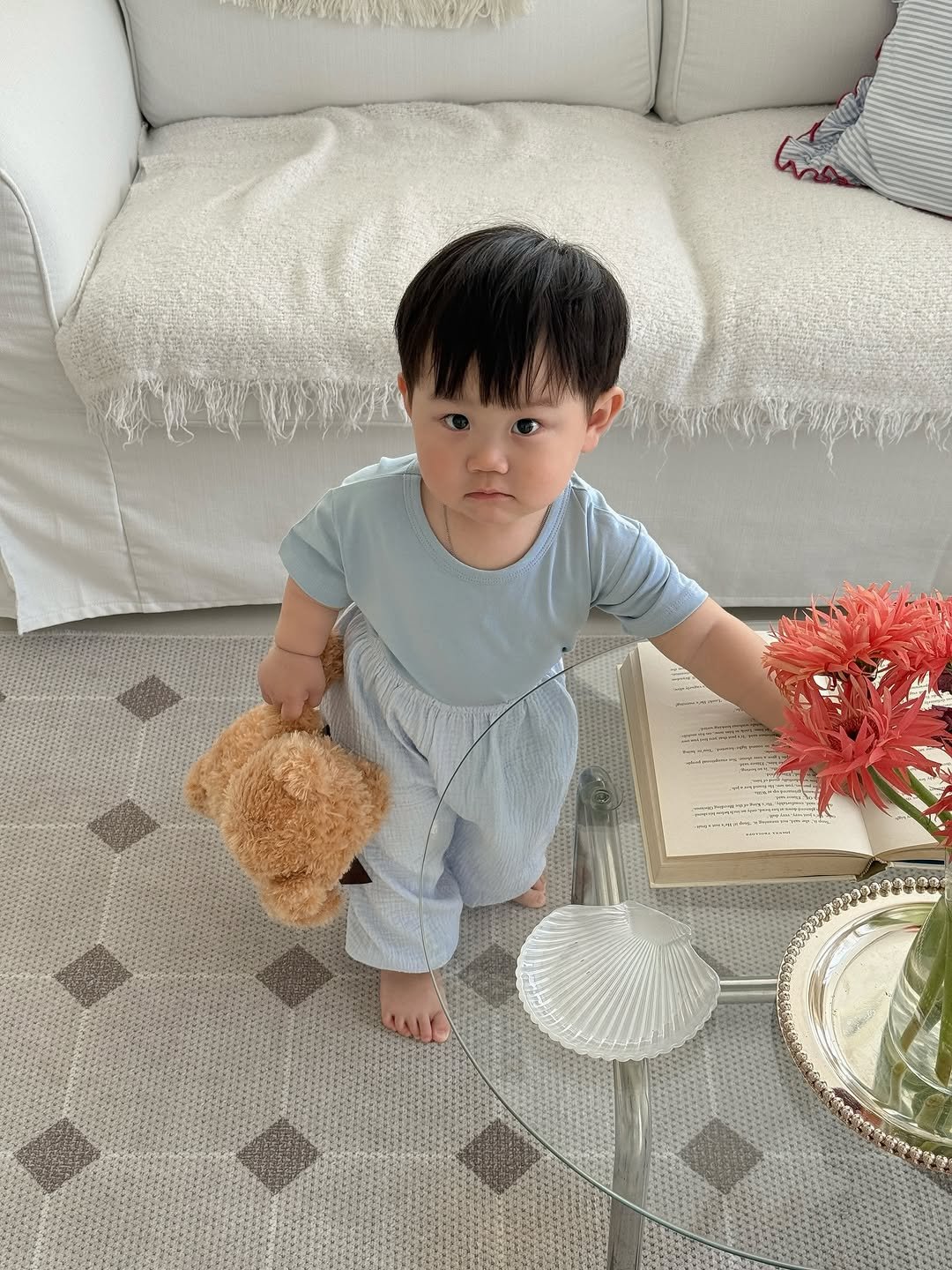 Photo shared by 윤샤샤 on April 15, 2026 tagging @1pro_official_. May be an image of baby, sleepwear and text.