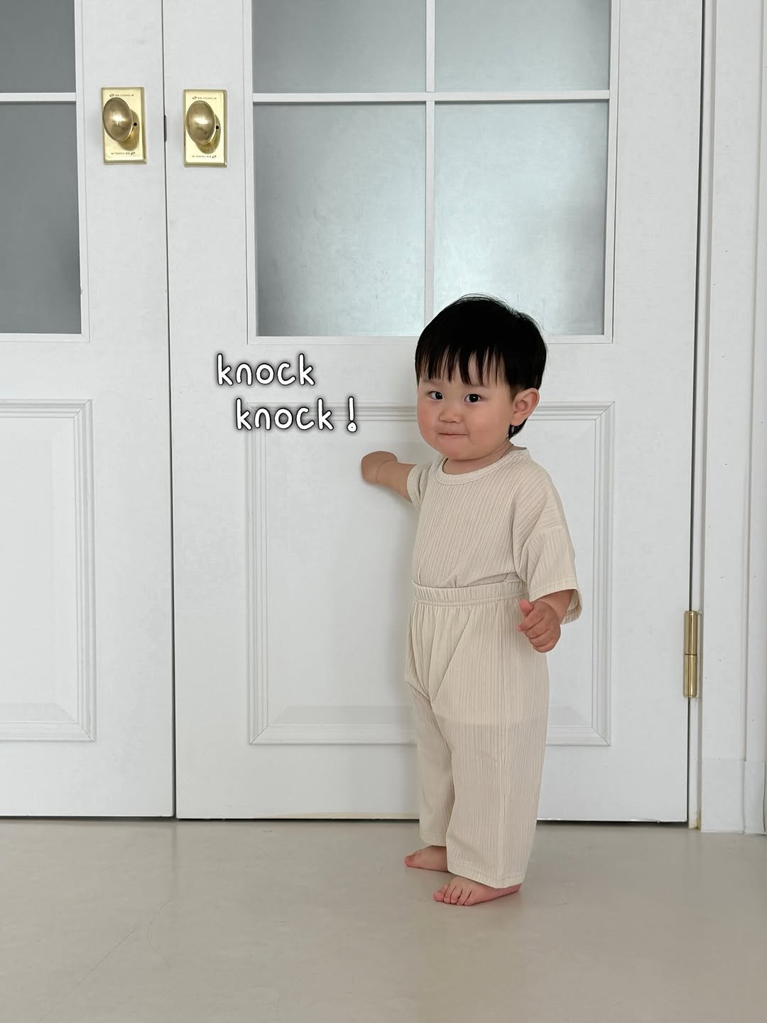 Photo shared by 윤샤샤 on April 17, 2026 tagging @1pro_official_. May be an image of baby, standing, baby shoes and text that says 'knock knock! !'.