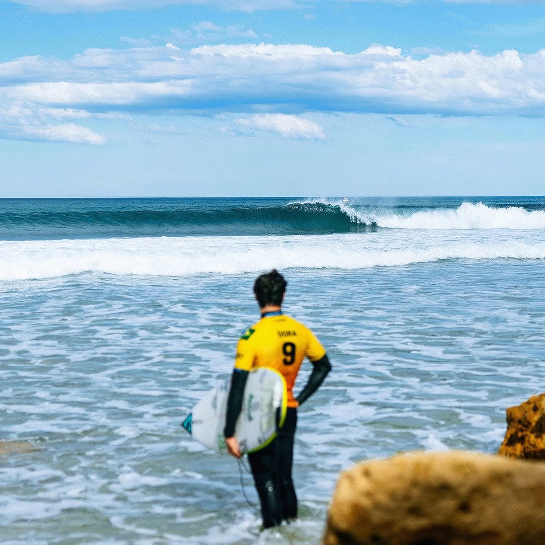 Photo by yAGO doRA on April 09, 2026. May be an image of surfboard, wetsuit, water, ocean, beach and text.