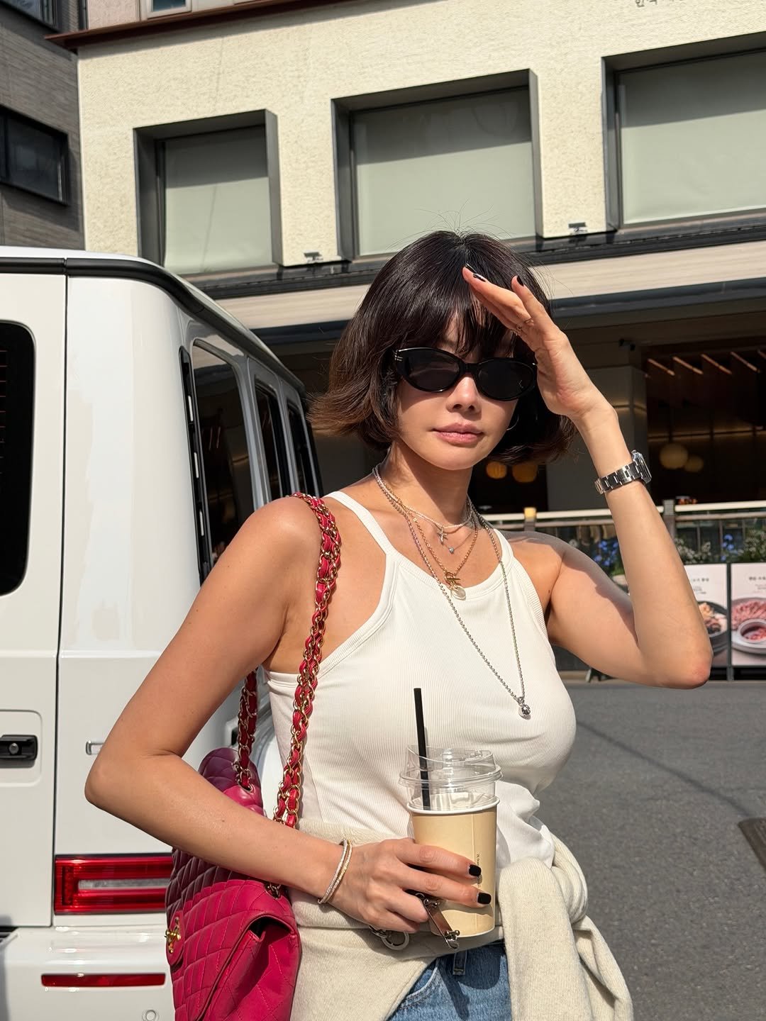 Photo by 양미라🧡미라씨 on April 25, 2026. May be an image of one or more people, eyewear, street and text.