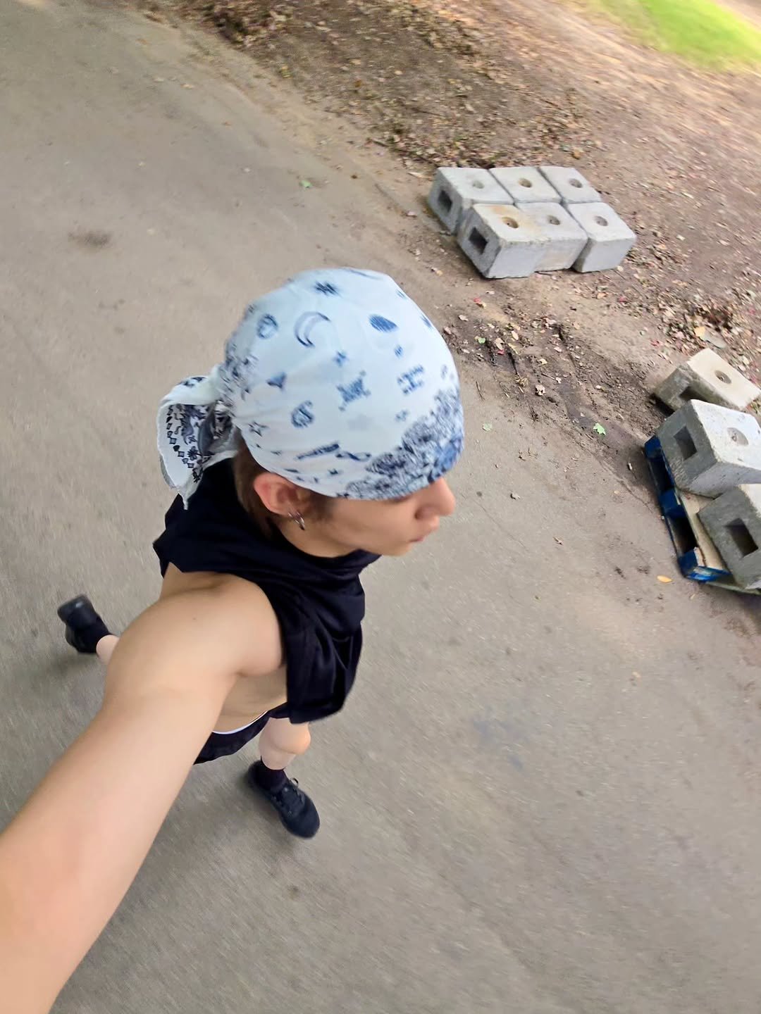 Photo by YEONJUN on October 03, 2025. May be an image of 1 person, bandanna, sweat band, headscarf, turban, park and text.