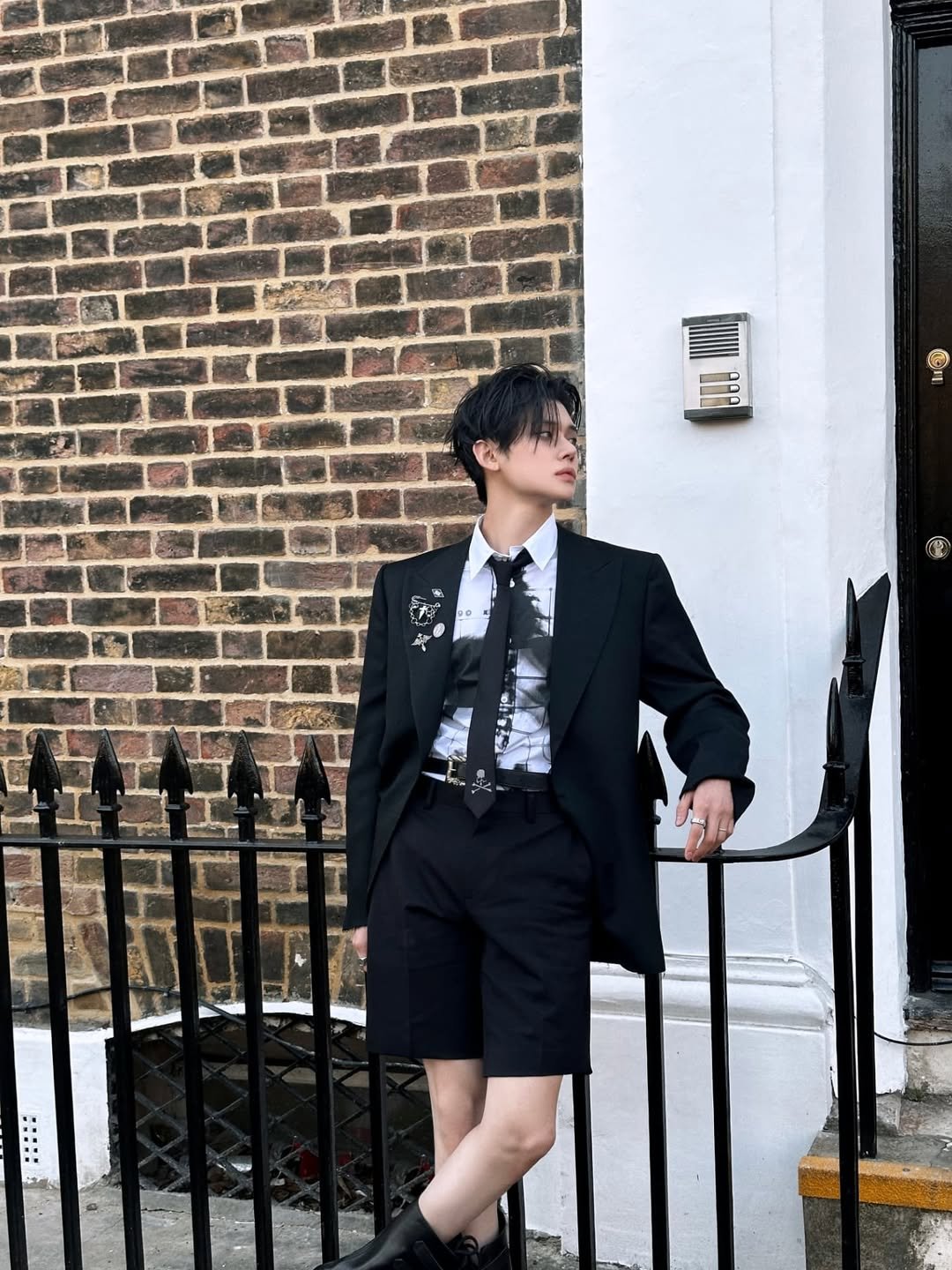 Photo by YEONJUN on July 31, 2025. May be an image of wingtip shoes, overcoat, bolo tie, dinner jacket, blazer, suit and text.