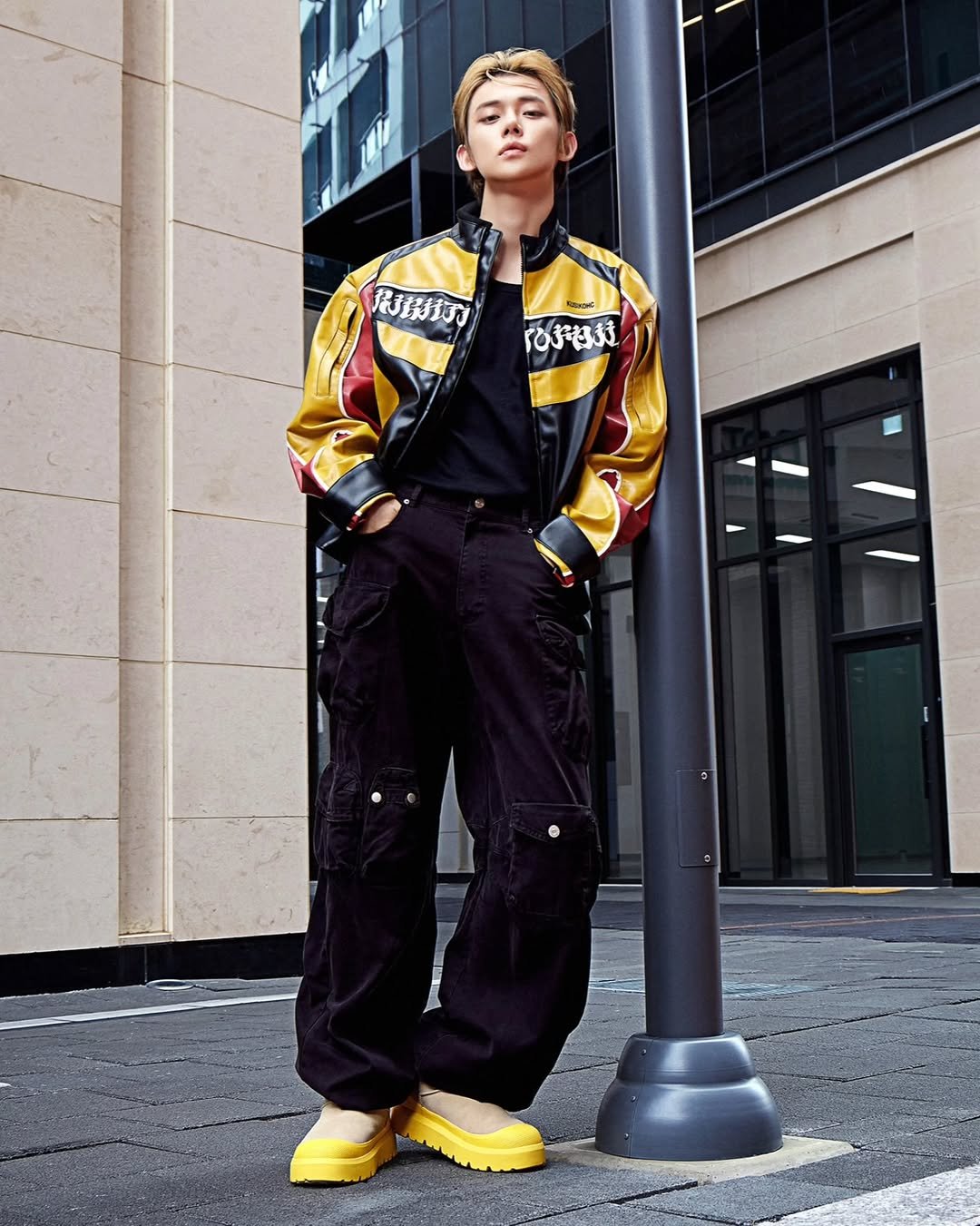 Photo shared by YEONJUN on September 24, 2025 tagging @ugg, and @ugg_korea. May be an image of 1 person, jacket, raincoat, sportswear, footwear and text.